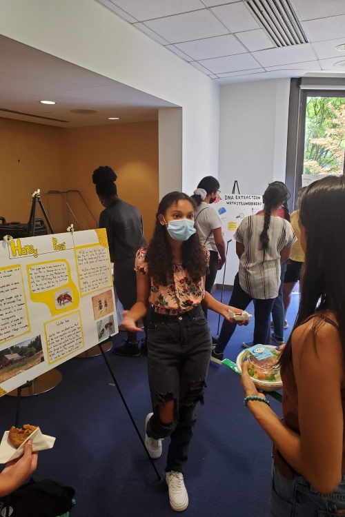 Student presenting a poster
