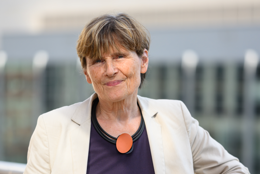Professional photo of Ruth Lehmann with building in background